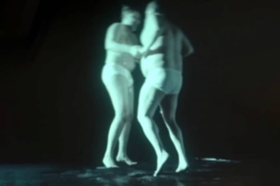two men in underwear bouncing togetehr