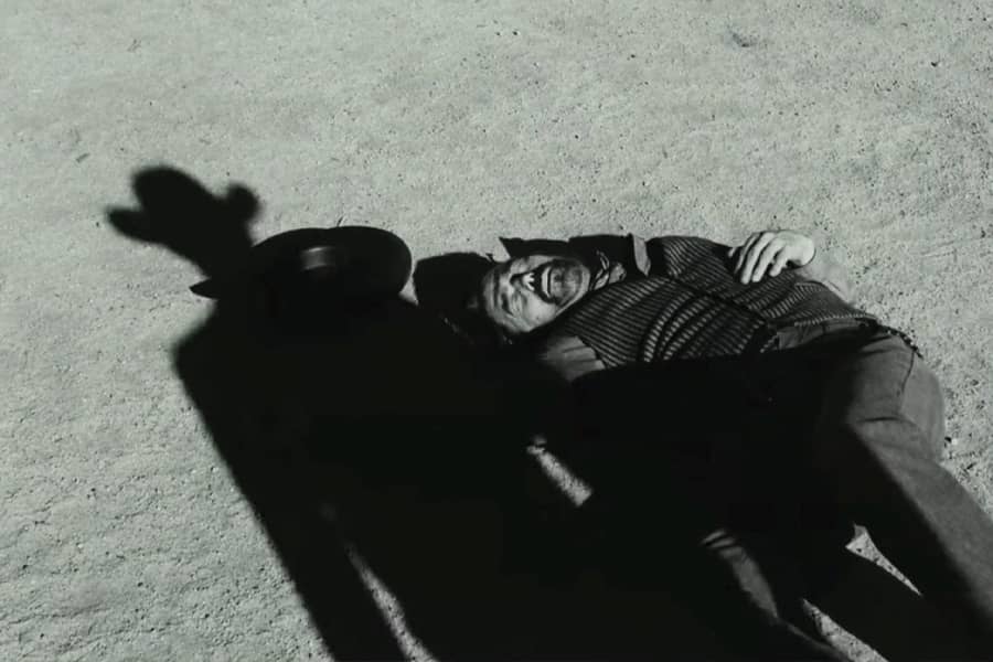 Cahill casts a shadow on a man unconscious on the ground