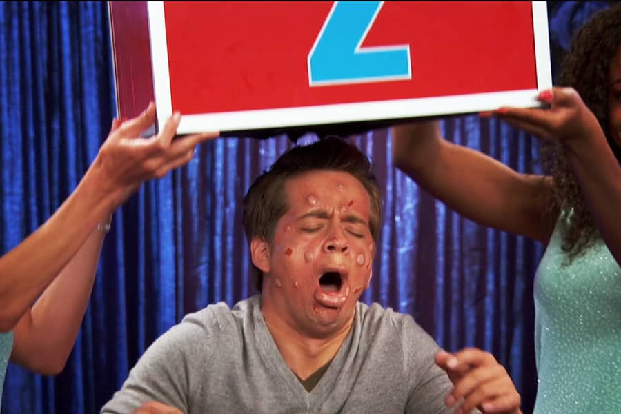 box 2 being removed from contestant’s head and his face is covered in welts