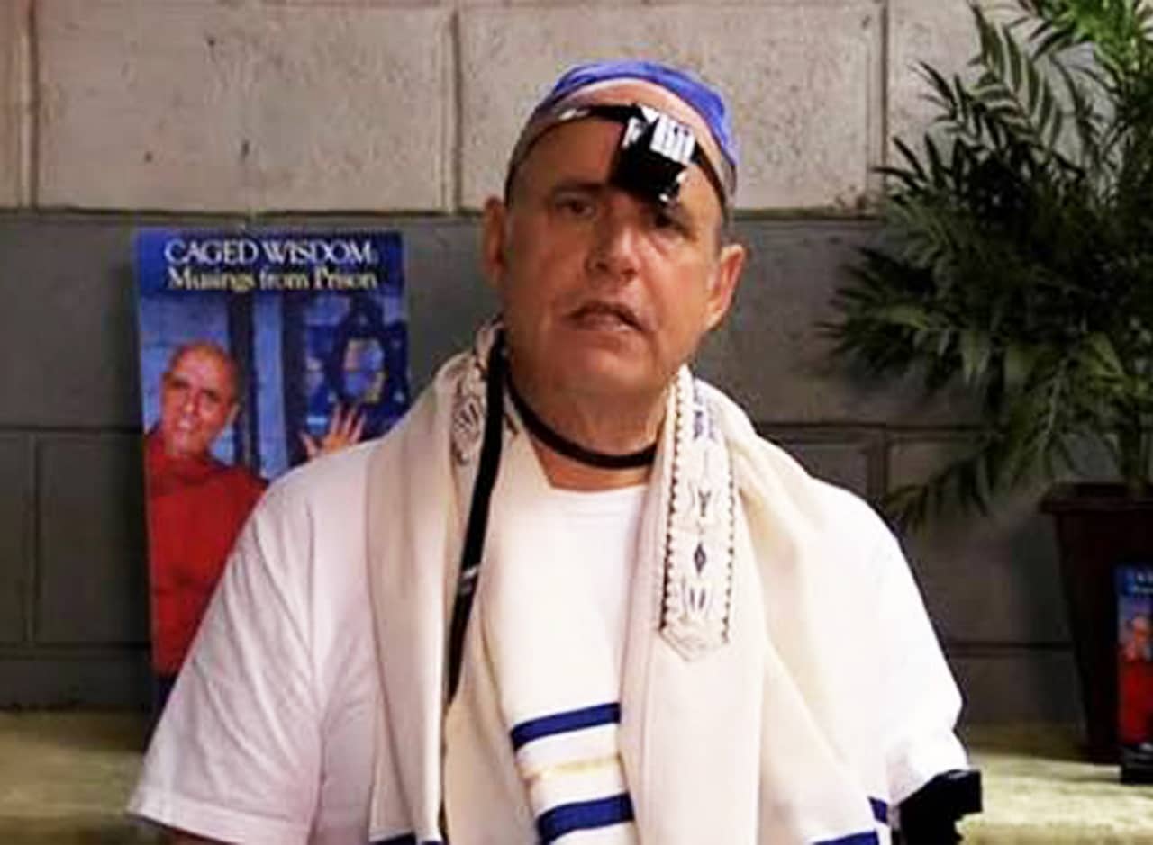 George Bluth wearing a Jewish prayer shawl and yarmulke