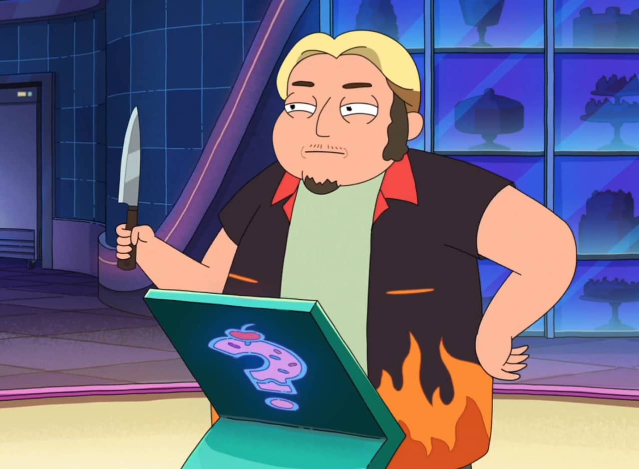 contestant in flame shirt holds up a knife