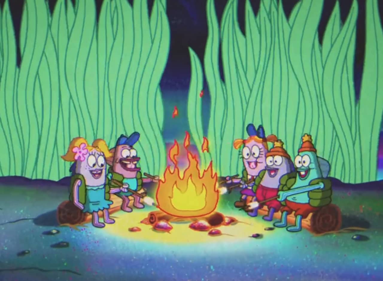 a group of fish kids around a campfire