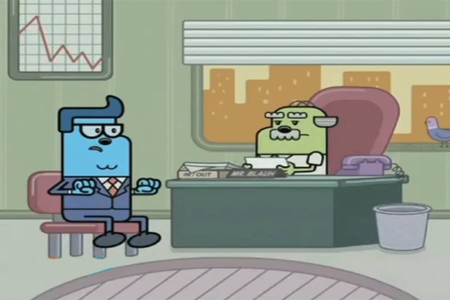 two men having a conversation in an office