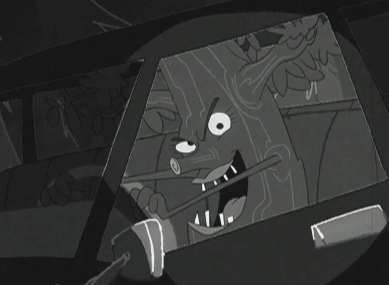 tree with a sinister face driving a car