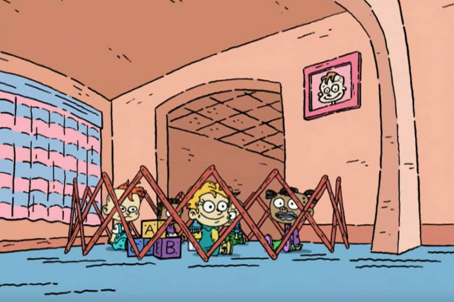 babies in a pen in a living room