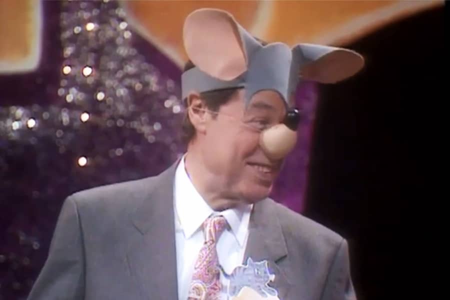 a contestant wearing mouse ears and nose