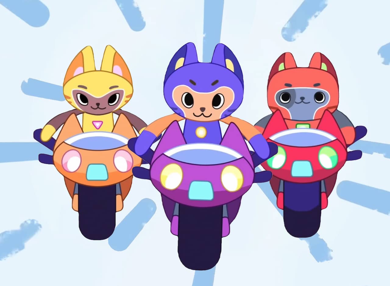 three cats in colorful helmets riding motorcycles