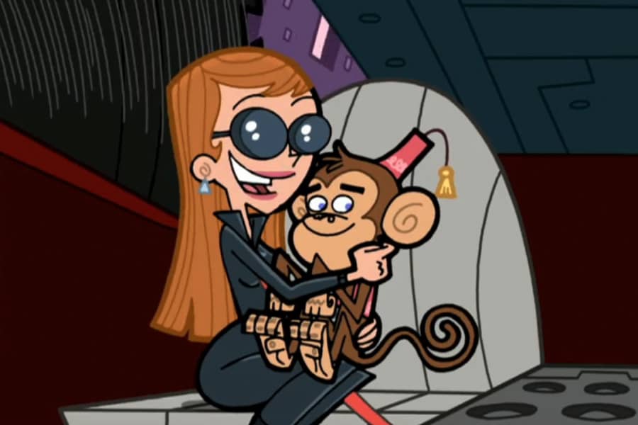 Tina Tune-up holding a monkey in a fez