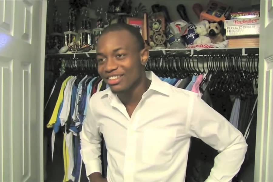 Charley standing in front of a closet