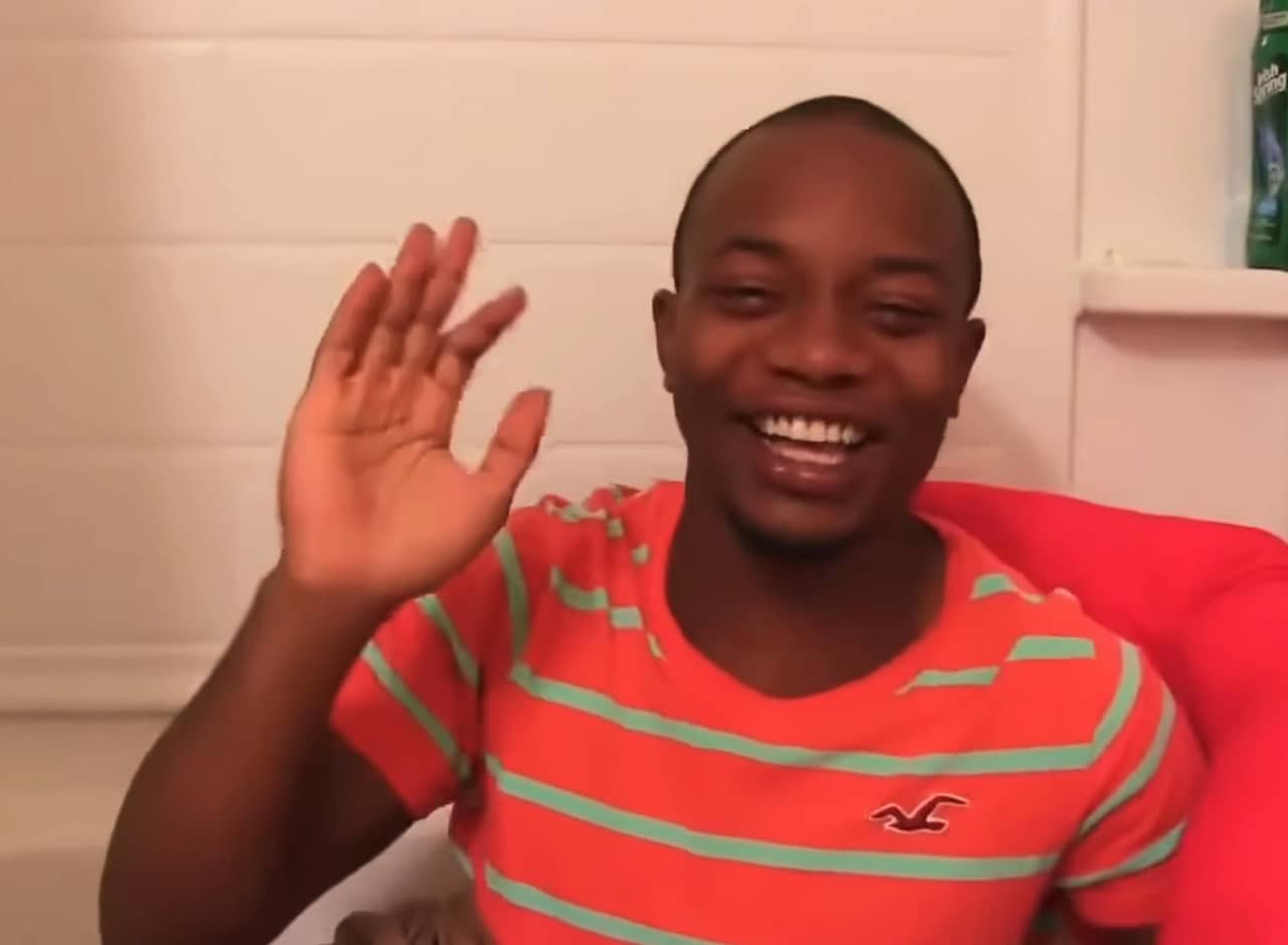 Charley waving from his bathtub where he was sleeping