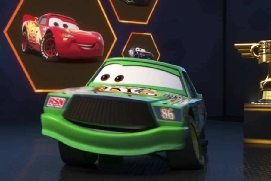 Chick with Lightning McQueen on the screen behind him