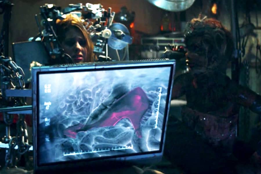 Cinderhella shows the girl an x-ray with a visible red high-heeled shoe