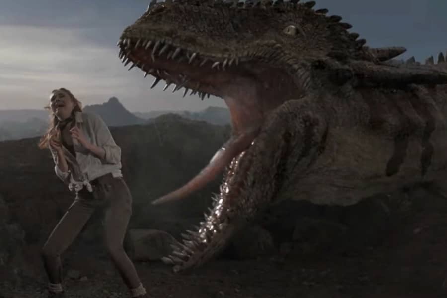 Carol Cobb as Dr. Lacey Nightingale screams as a huge dinosaur roars right next to her