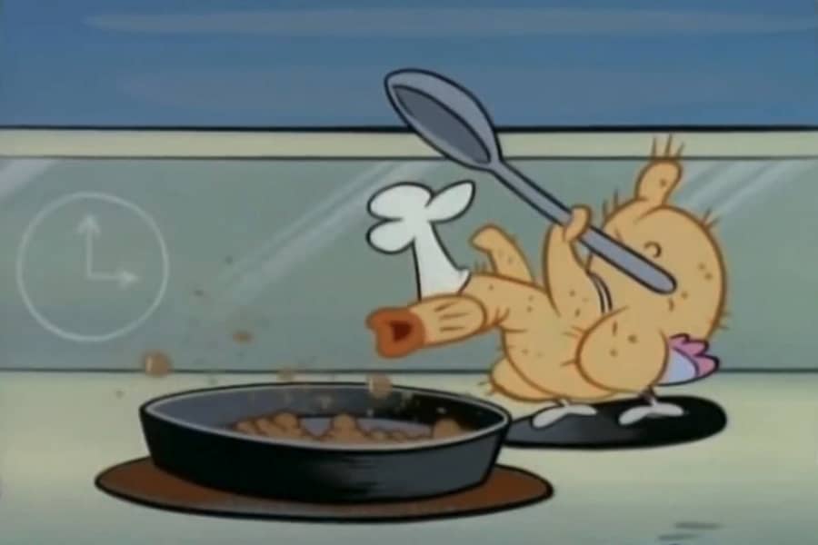 chicken chef leaning over a pan with bubbly food