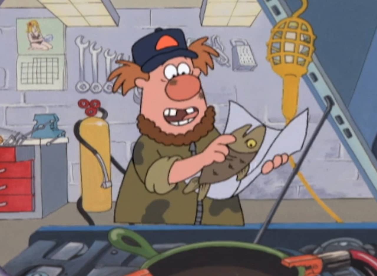 a guy in a garage wraps a fish in tin foil, a pan is connected to a car engine with jumper cables