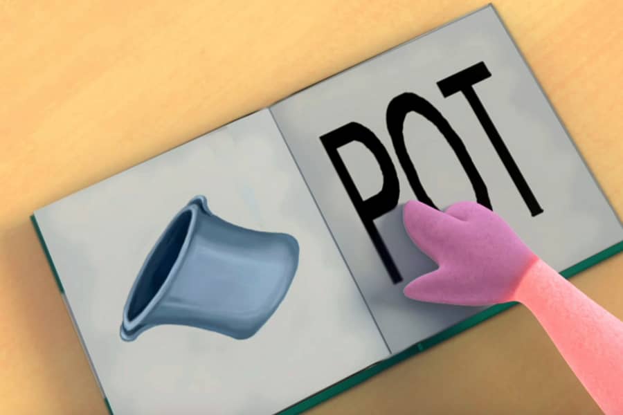 Pig’s hoof pointing at a book open to a page with a pot on it