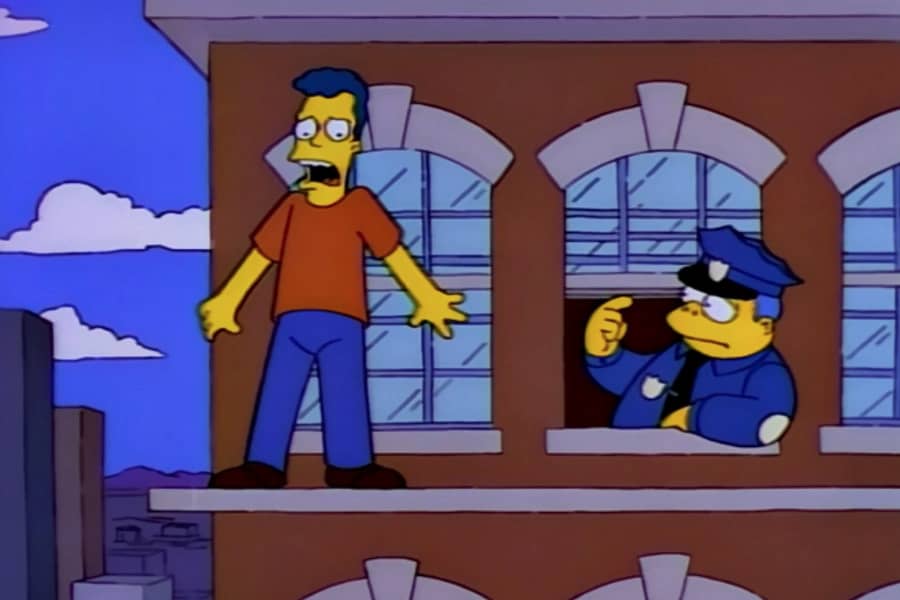 Chief Wiggum talks down a man standing on the ledge of a building