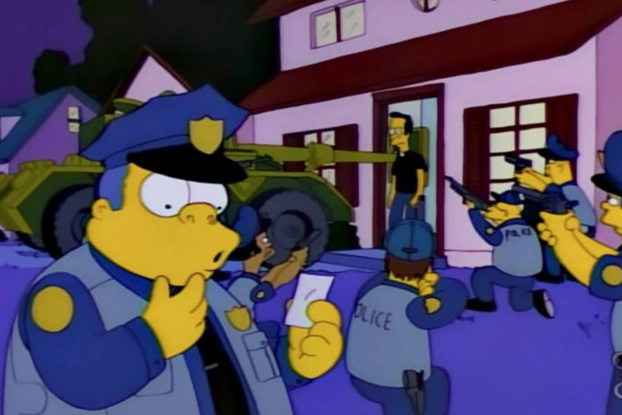 officers have guns and tanks drawn on a house but Chief Wiggum is surprised, looking at a small piece of paper