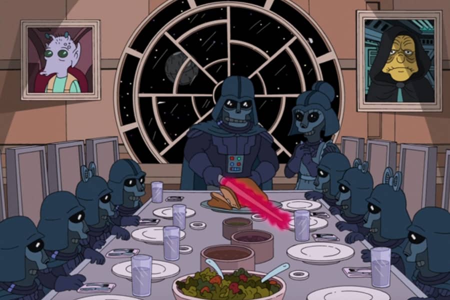 Darth Vader slices turkey with a light saber for his family
