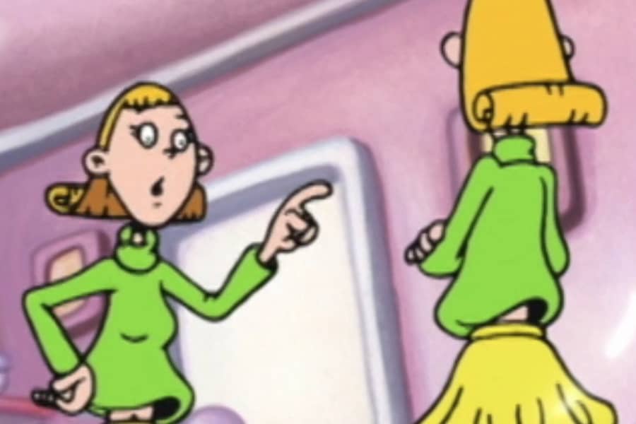 Gina talking and pointing at Tina