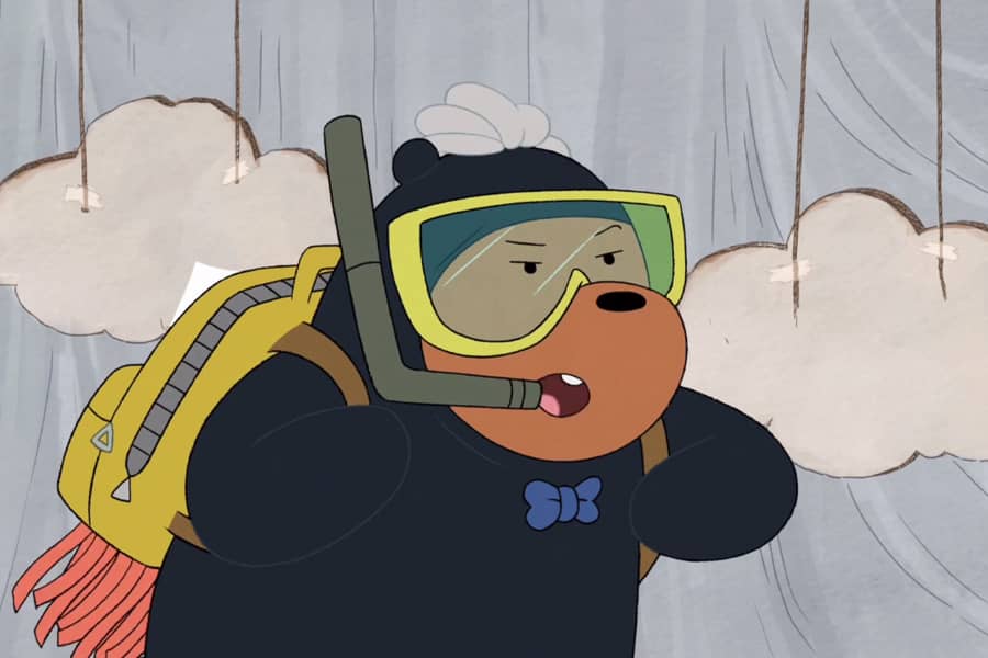 Crowbar Jones wearing a scuba suit and jet pack flying in front of handmade, cardboard clouds