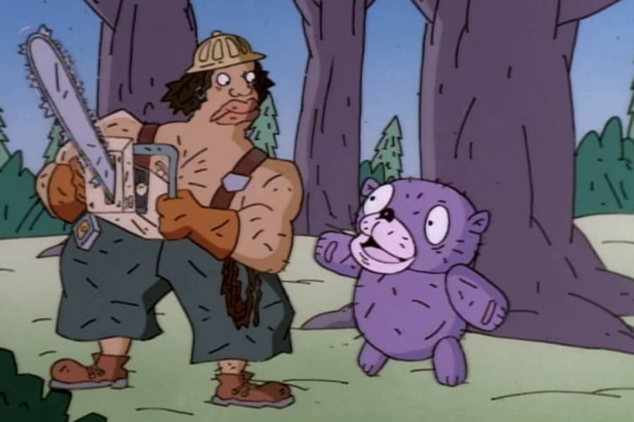Cuddles speaks to a lumberjack holding a chainsaw in the forest