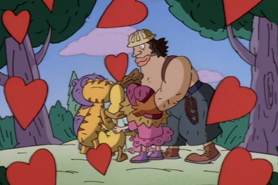 All of them hug as red hearts float around them