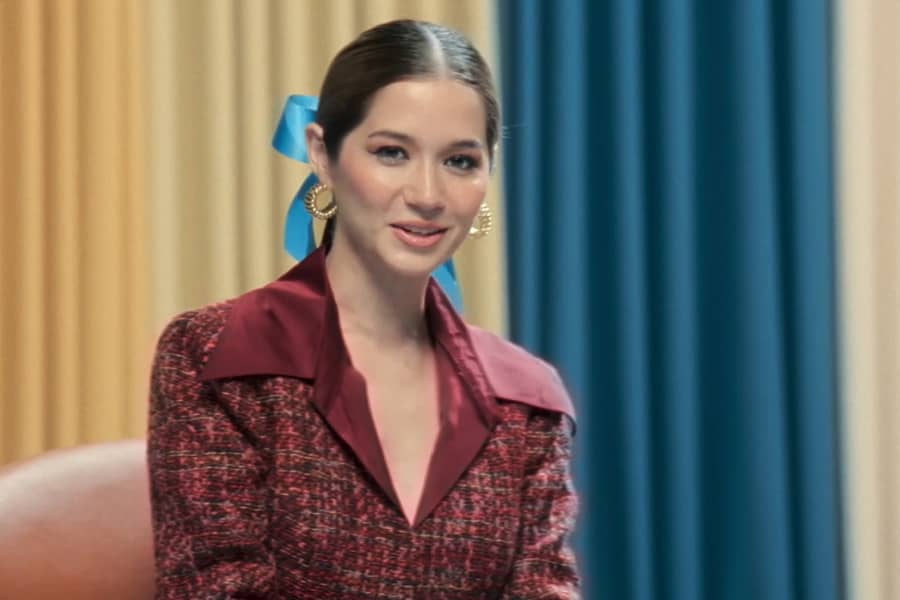 the younger woman speaks to the camera