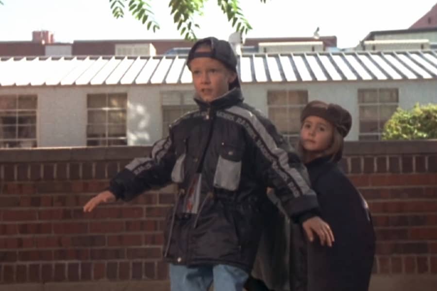 kid shielding his little sister