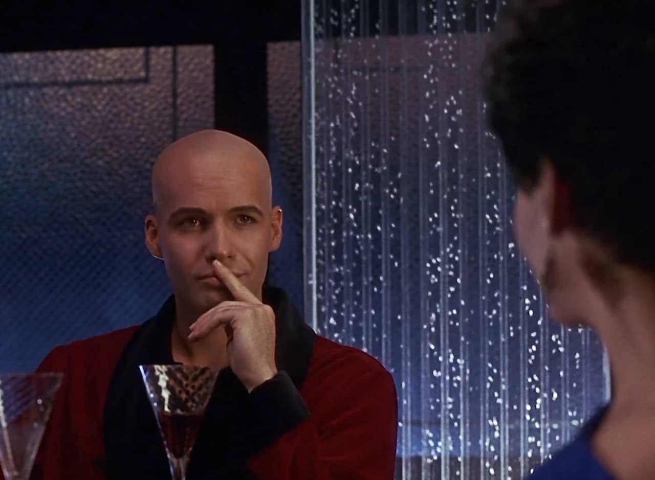 Billy Zane gives a coy smile toward a his date
