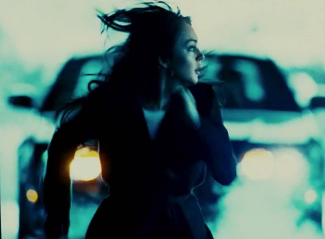 Lindsay Lohan runs away from an approaching car