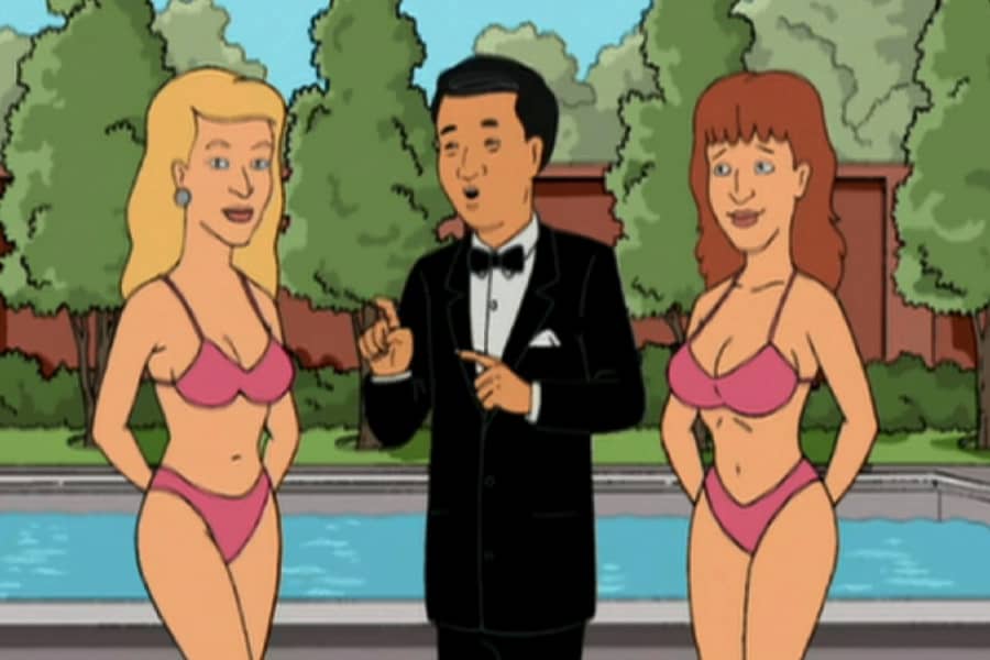 Dr. Money by a pool with two women in bikinis