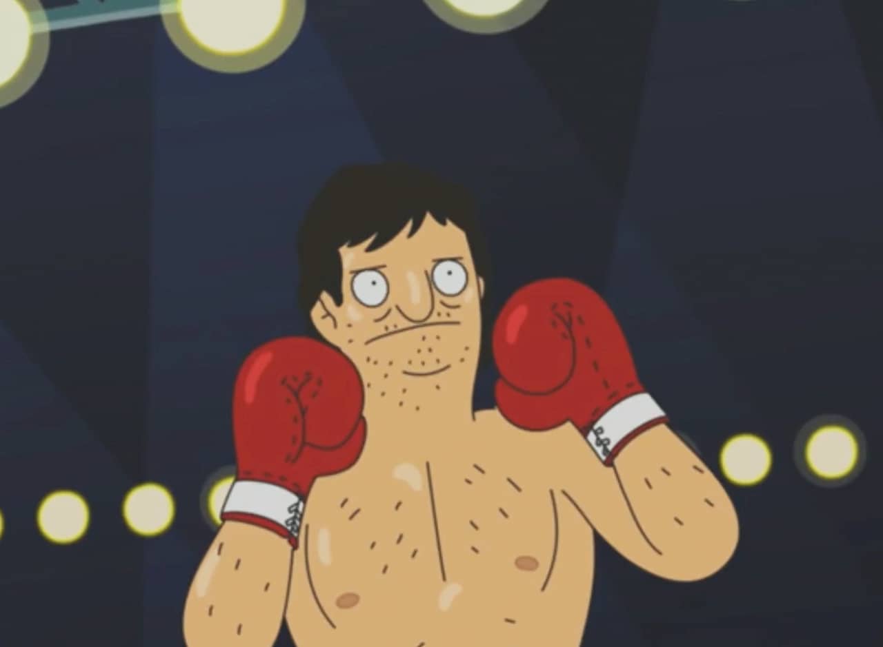a shirtless boxer in the ring