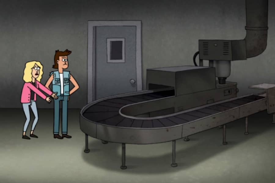 man and woman look at empty factory conveyor belt