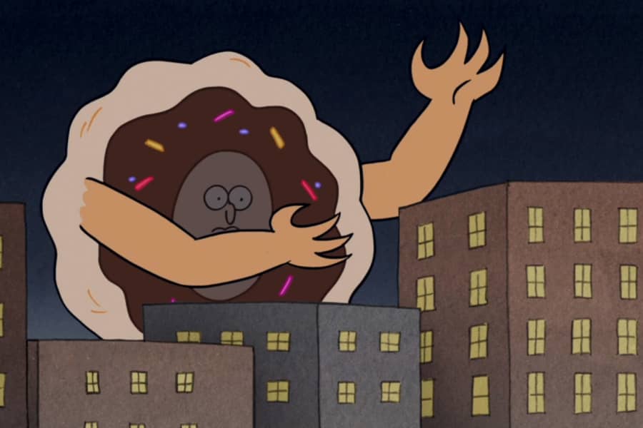 giant donut man walks amongst city buildings