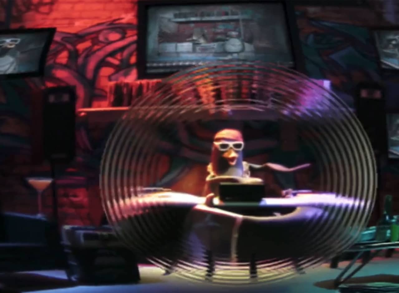 Dr. D, a penguin in sunglasses, spinning records