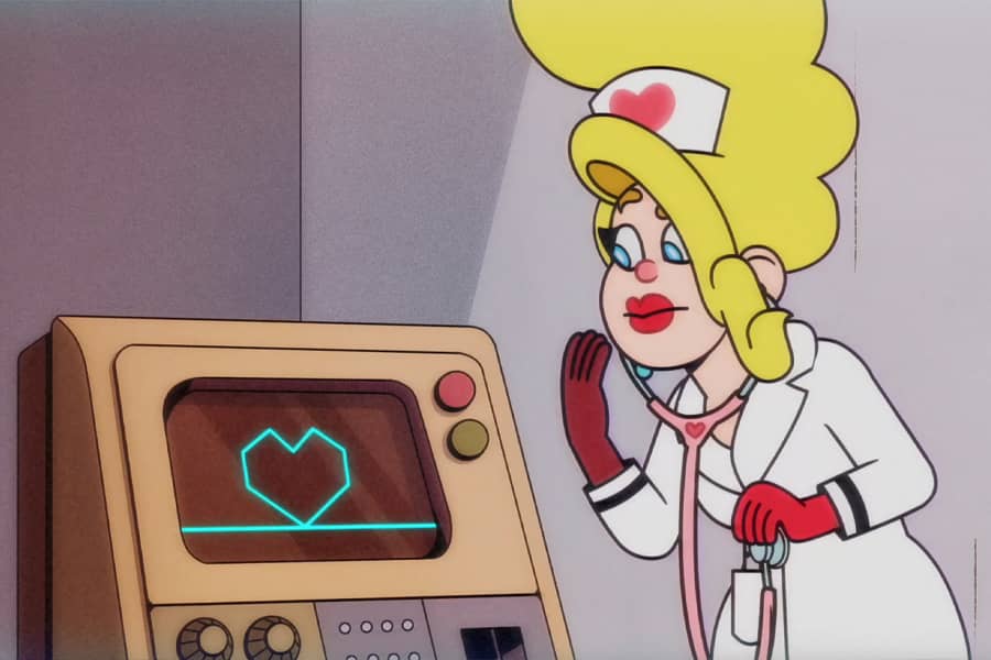 Dr. Love looking at an EKG that is showing a heartbeat in the shape of a heart