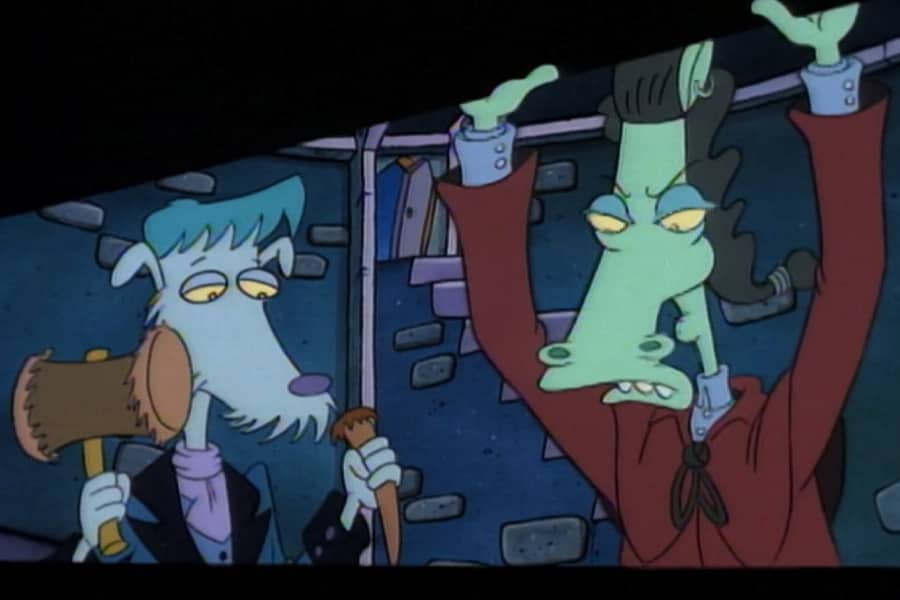 two guys looking into a coffin, one guy is holding a hammer and stake