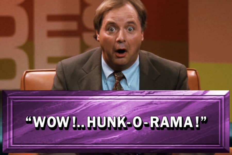 the host making a face with text on screen: “Wow! Hunk-O-Rama!”