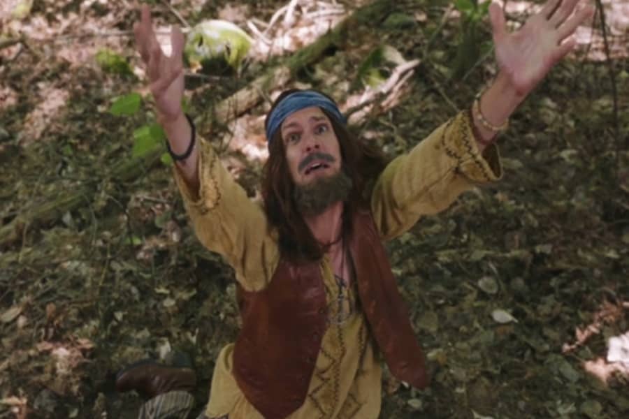 hippie man raising hands into the air