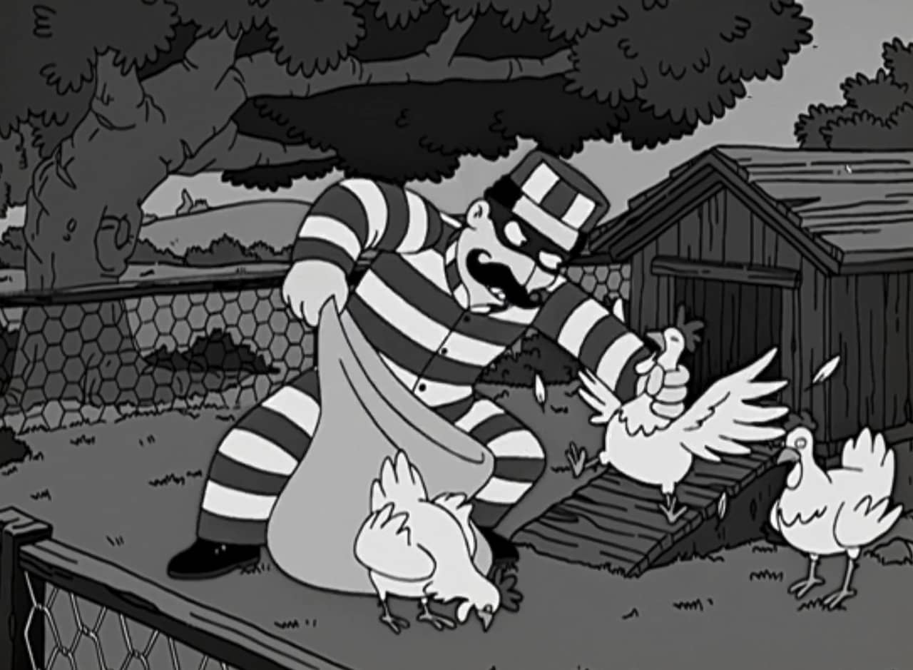 Italian Pete, in a striped prisoner’s outfit, stuffing chickens into a big bag