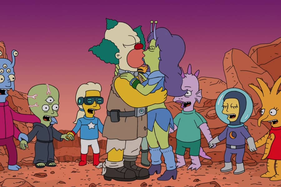Krusty kisses an alien woman while alien children stand around and cheer