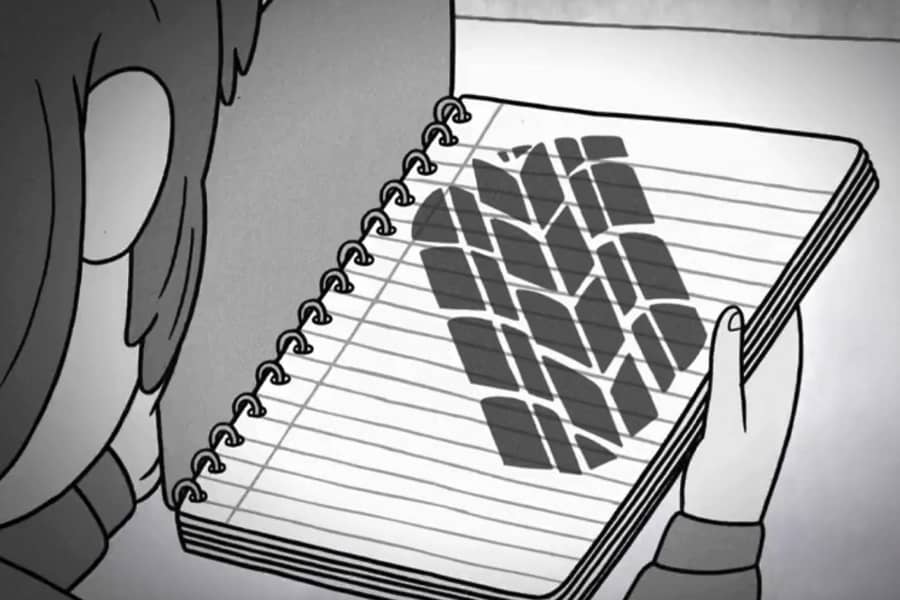 a boy opens his notebook and inside is a tire tread mark