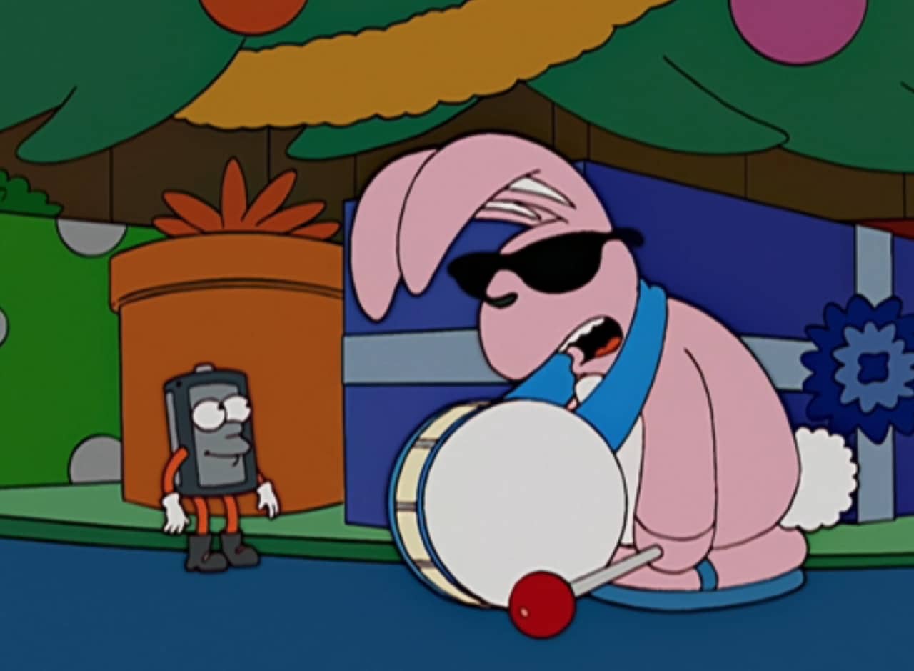 by a Christmas tree, the Energizer Bunny looks deflated, talks to a small battery