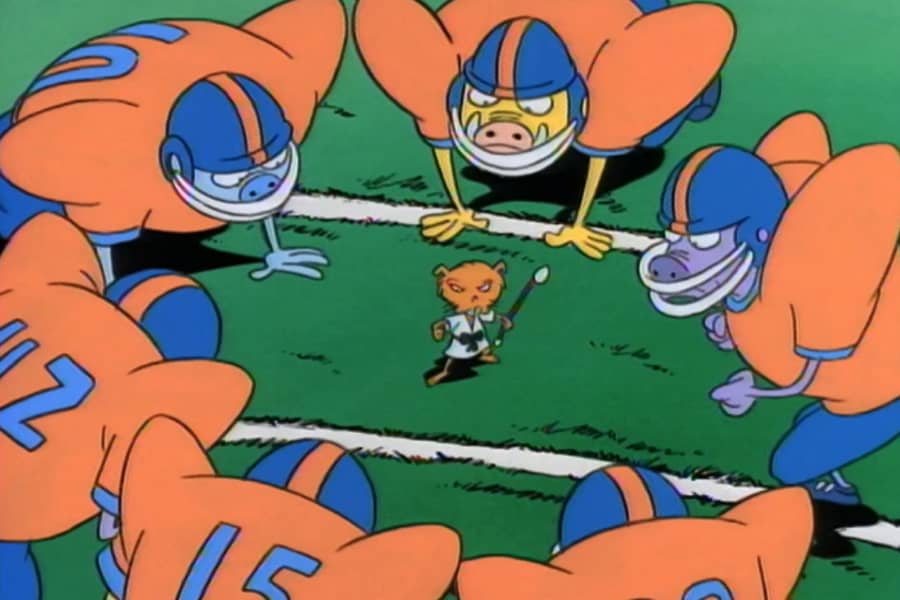 Lang-Chao surrounded by football players