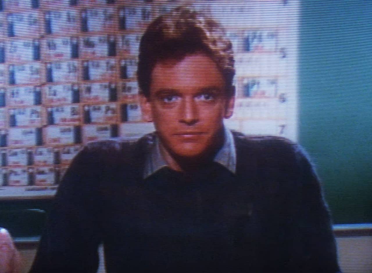 Jerry Hathaway in front of a periodic table