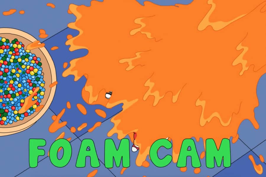 foam cam showing two people getting covered in orange foam