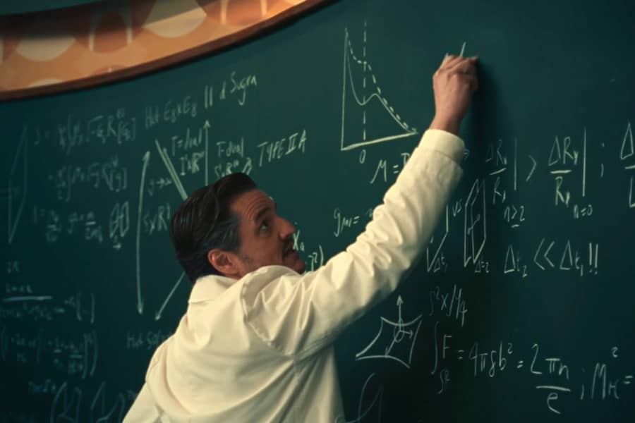 Richards writing on a blackboard