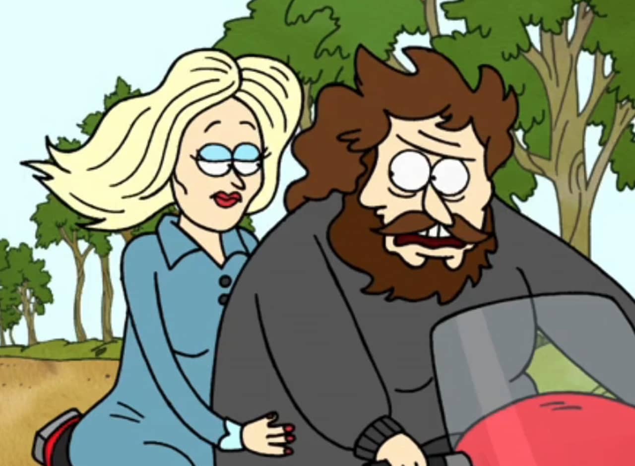 protagonist, a fat man with scraggly beard, riding a motorcycle with a blonde woman on the back