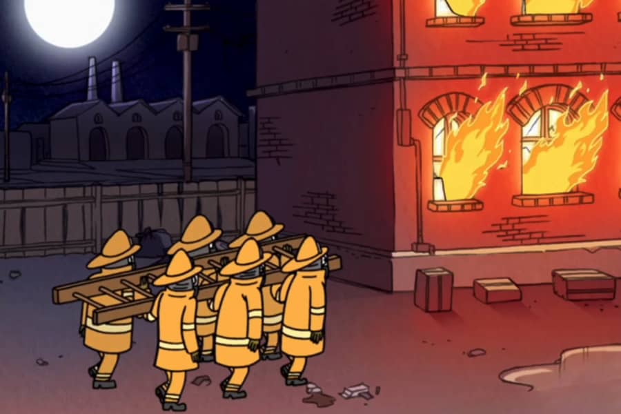firemen walking toward a building that’s on fire